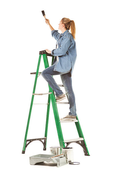 woman on a werner 6 ft step ladder type II